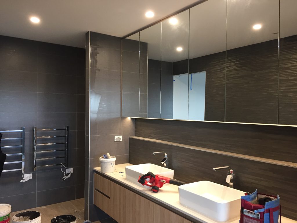 floor to ceiling tiles wit chrome angle